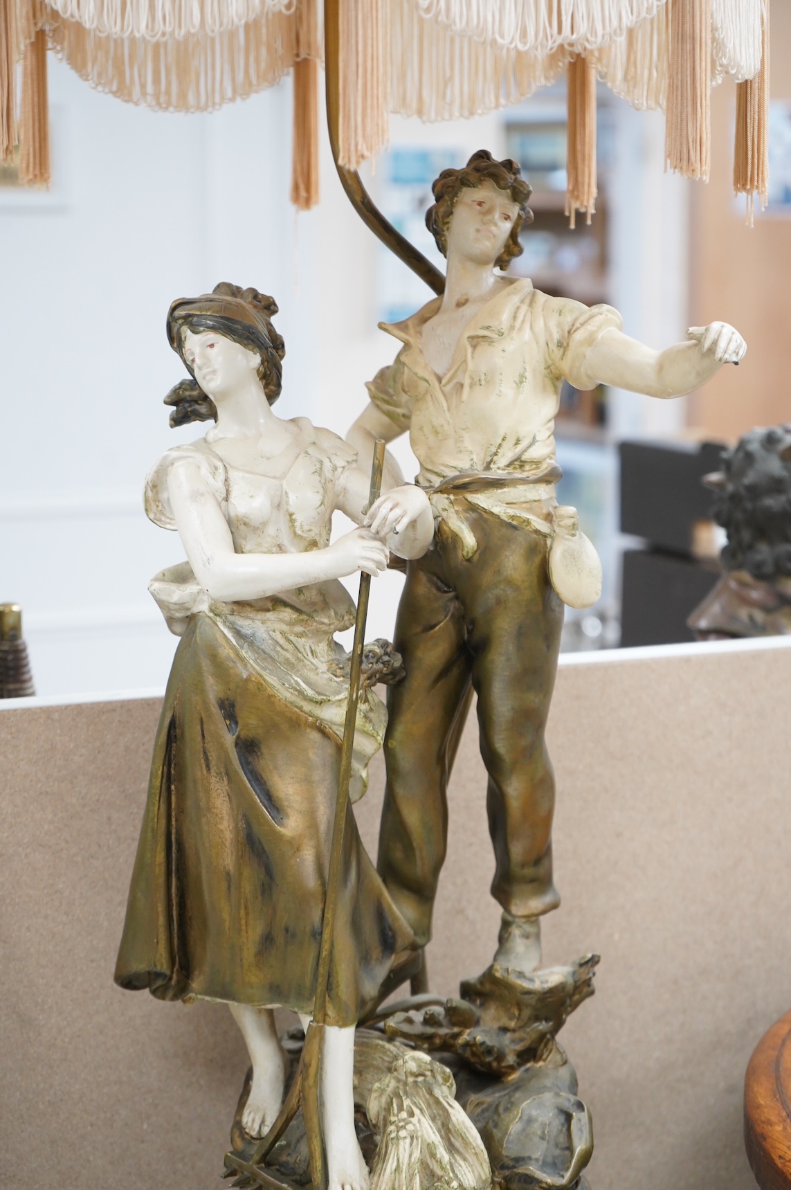 A figural spelter lamp with shade, 90cm high